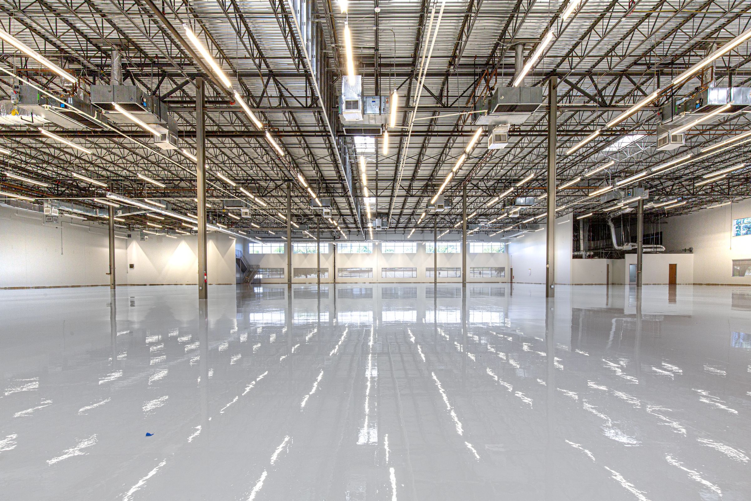Autonomous floor scrubber on a vast polished floor